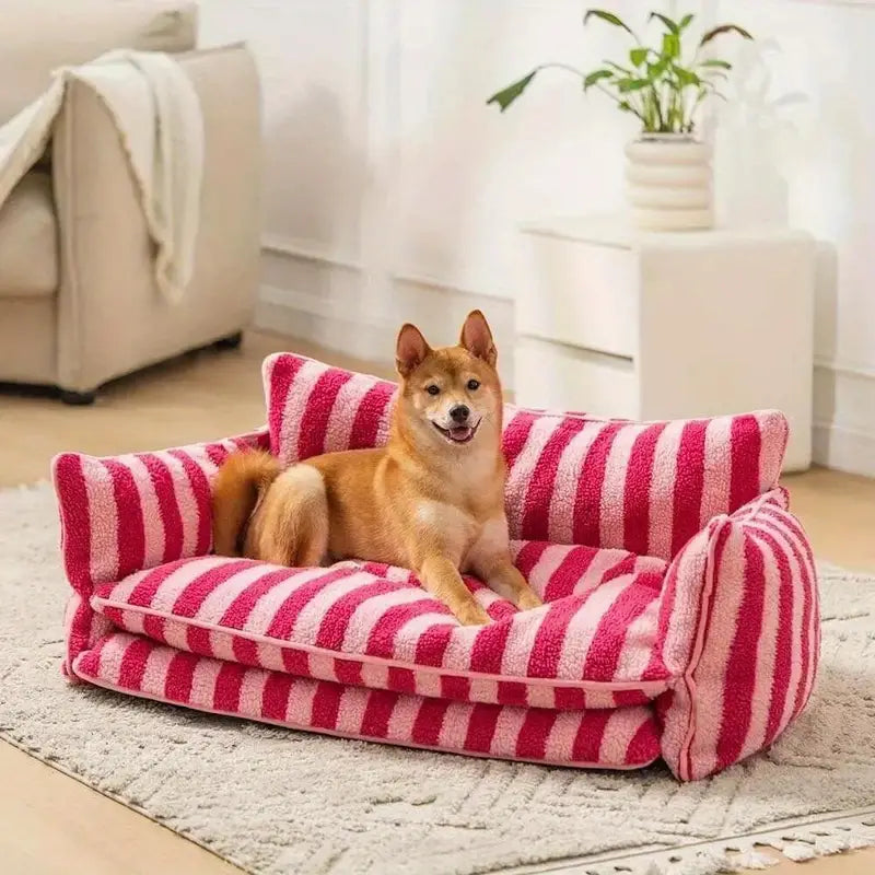 Comfortable dog enjoying the plush pet sofa bed.
