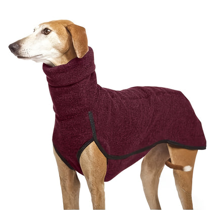 A brown dog modeling a burgundy turtle neck sweater