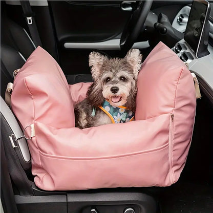 Small dog enjoying a cozy car ride in a pet seat bed.
