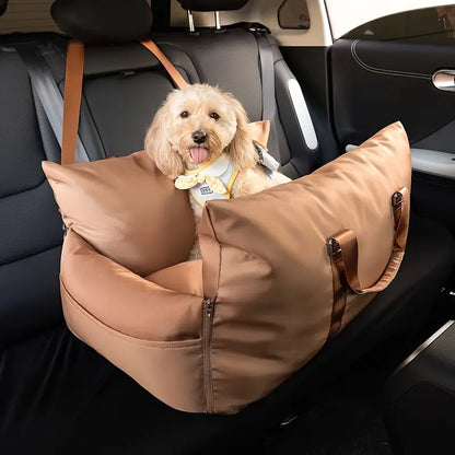 Small dog resting comfortably in a waterproof pet car seat bed.
