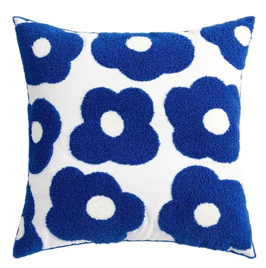 pillowcase features a pattern of blue flowers on a white background.