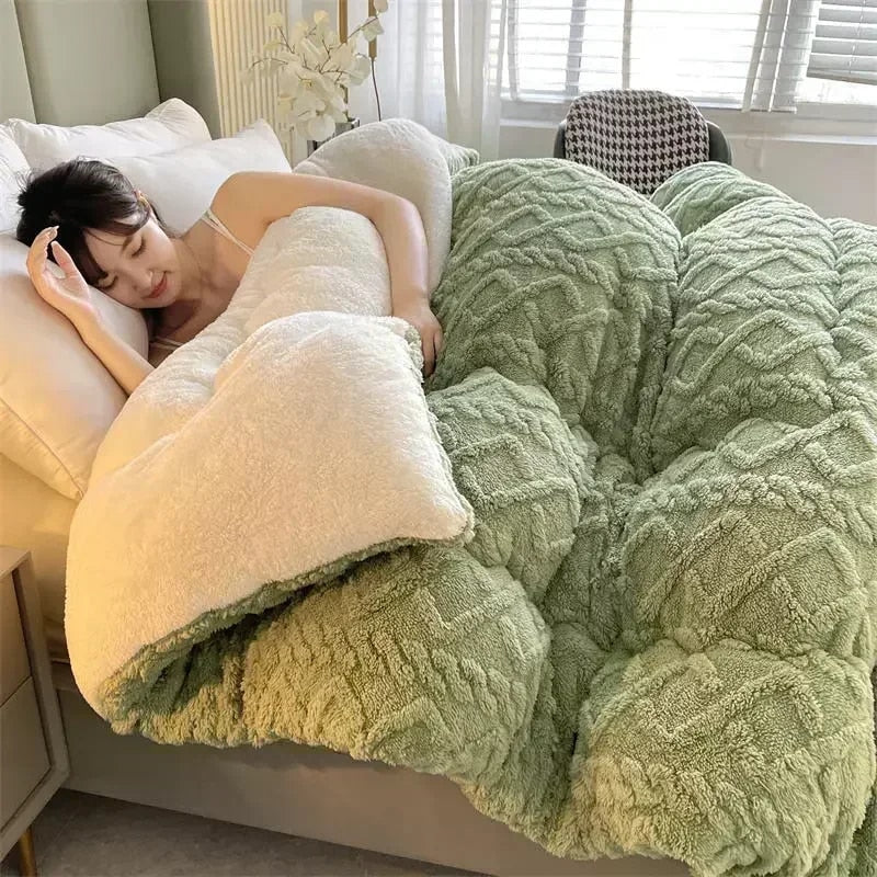 "Lady lying down in bed, covered with a soothing soft green washable pet blanket."