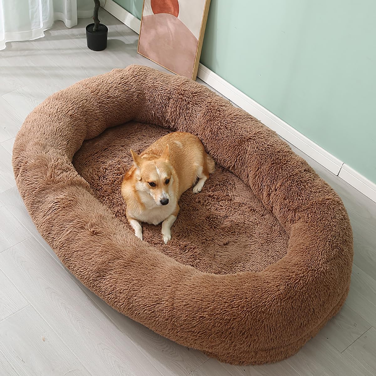 "A dog lounging in a brown bed, perfectly content and cozy in its plush surroundings."