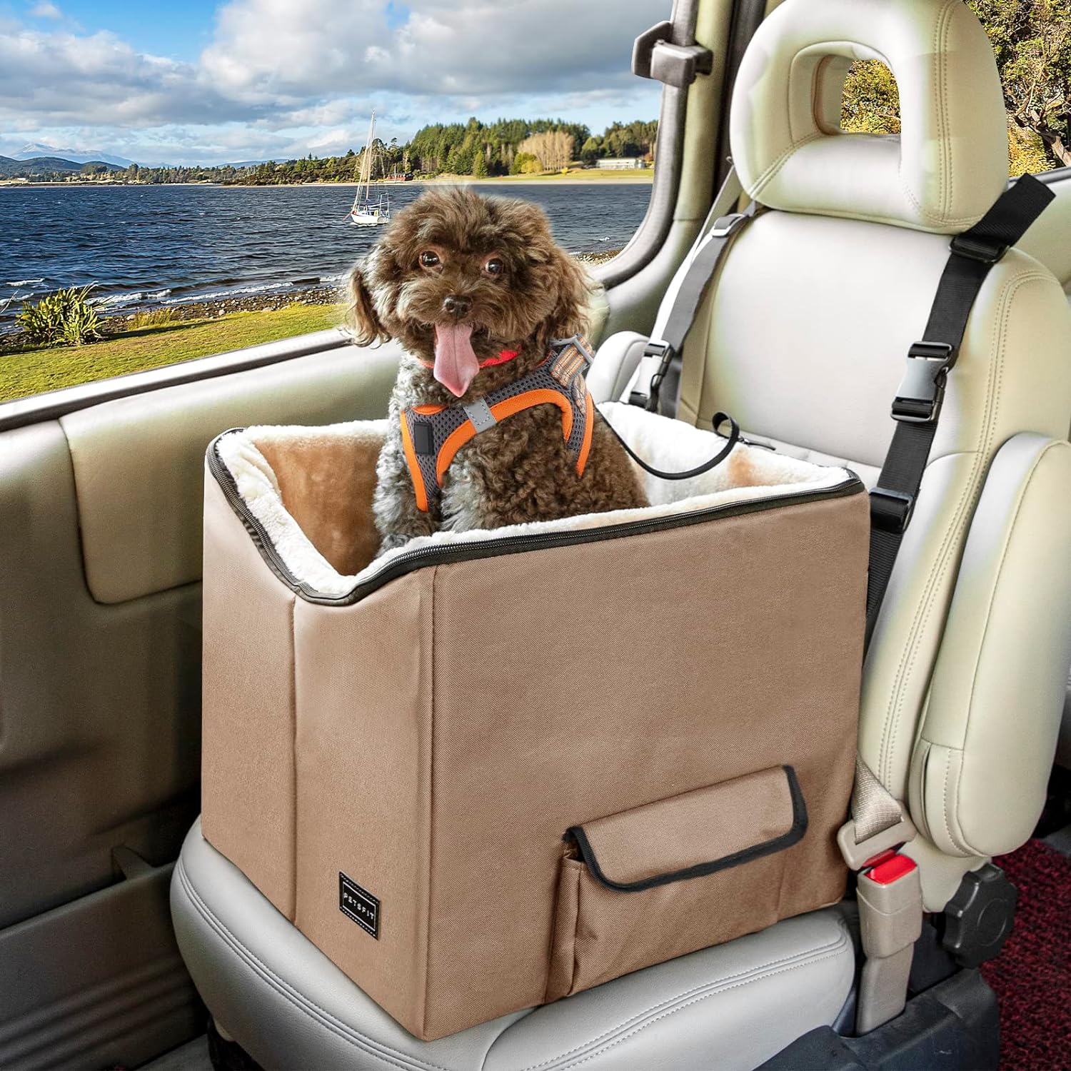 a  dog booster seat in tan color with a light brown dog sitting inside, mounted on a car seat.