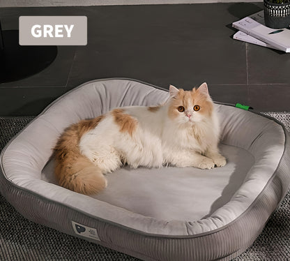 Cozy oval pet bed with plush cover, featuring built-in neck support for cats and dogs in grey color