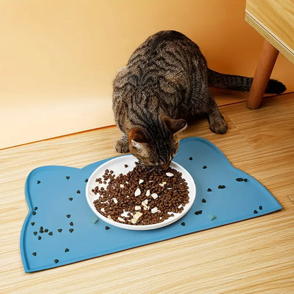 Cat eating on Blue Feeding Cat Feeding Mat  - Absorbent and Non-Slip
