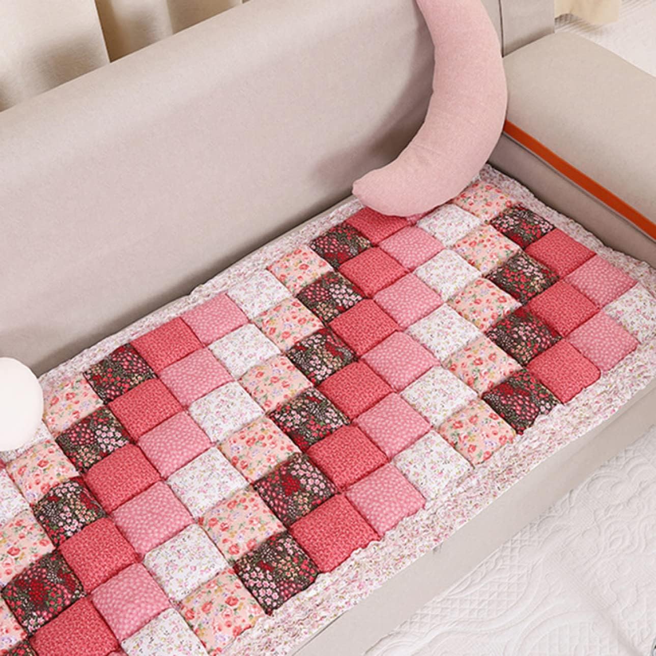 "Diagonal floral patchwork pattern feature on a quilted sofa cover."
