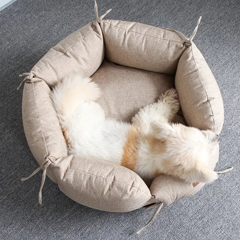 Beige Round Dog Bed with Dog Lying in Washable Small Pet Bed in cozy home setting"
