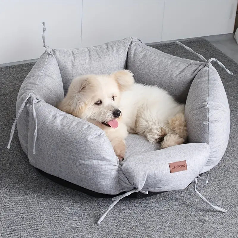 Grey Round Dog Bed with Dog Lying in Washable Small Pet Bed in cozy home setting