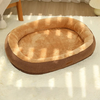 Comfortable oval orthopedic dog bed for medium and large dogs, with washable non-slip bottom.