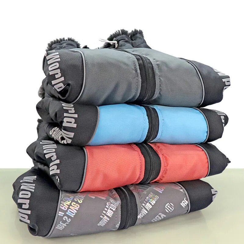 "Four different designs of the waterproof dog jacket, showcasing variety."
