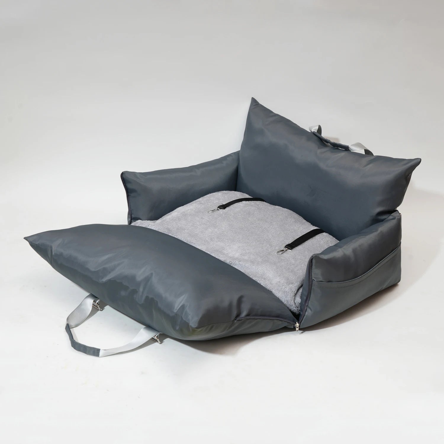 "Grey travel bolster bed unfolded, showcasing its spacious design."
