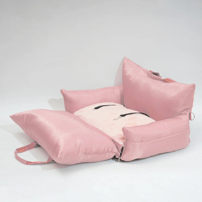 "Pink travel bolster bed fully unfolded, ready for pet rest."
