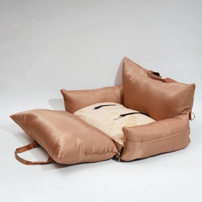 "Brown travel bolster bed unfolded, showing off its plush surface."
