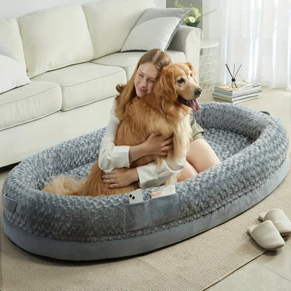 Lady & Golden Retriever, Dog sitting up enjoying Large Human-Sized Dog Bed with Cozy Blanket.
