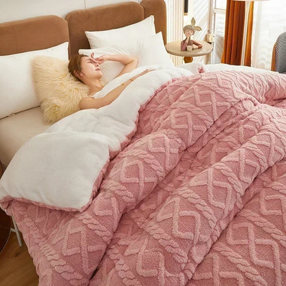 "Lady resting in bed under a cozy, soft pink velvet plush pet blanket."
