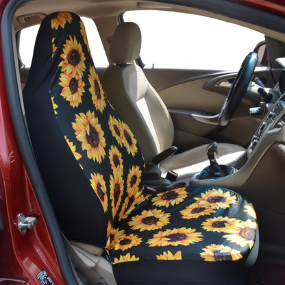 A front seat of a car with a sunflower car seat covers