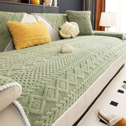 a sage green geometric-patterned sofa cover