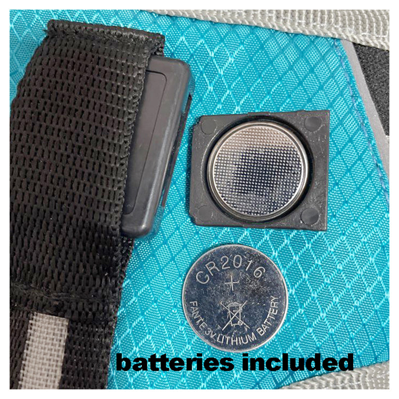 "Image showing the harness's batteries included for the LED feature."