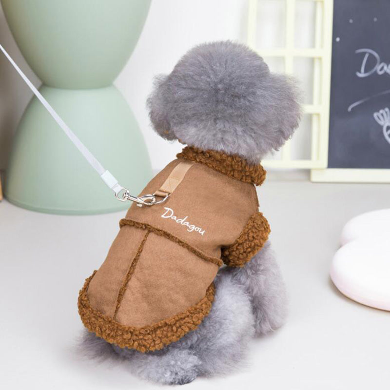 "Rear view of a small dog in a brown lamb fleece vest, showcasing the vest's back design."
