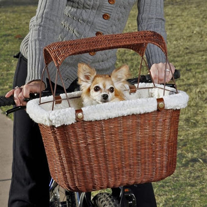 A Dog Inside the Brown Wicker Bike Basket