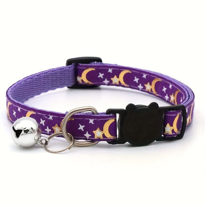 Purple dog collar with bell, crescent moons, and stars.