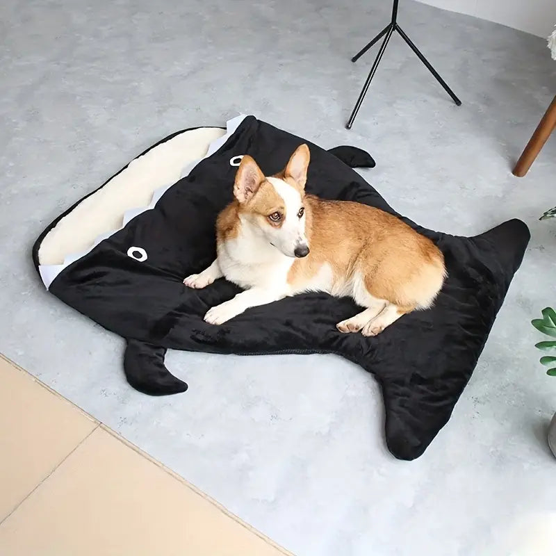 Shark-shaped dog cave nest with warm cushion for comfort.
