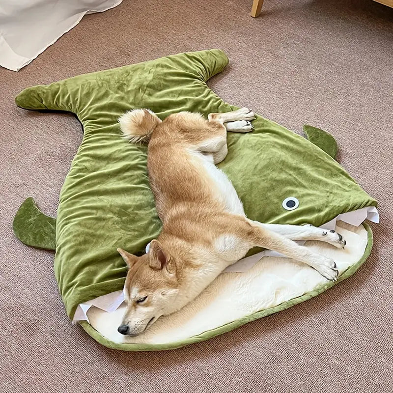 Cozy dog bed with non-slip base and playful shark design.
