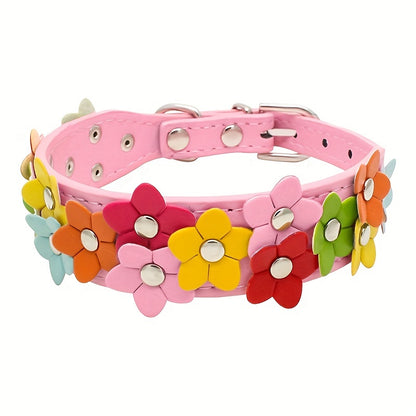 Pink dog collar featuring a cheerful pattern of yellow, red, and white flowers.