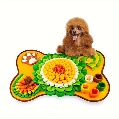 a small dog with yellow orange snuffle mat