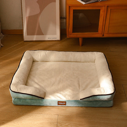 Green memory foam bolster dog bed in a beautifully furnished room.