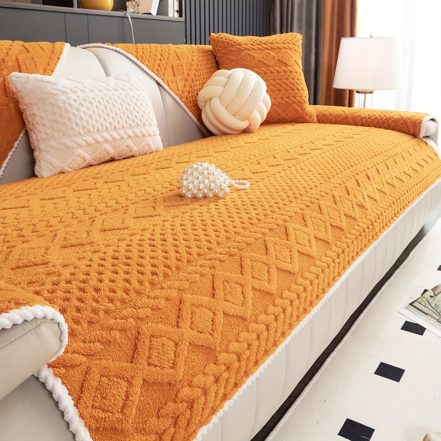 an orange geometric-patterned sofa cover