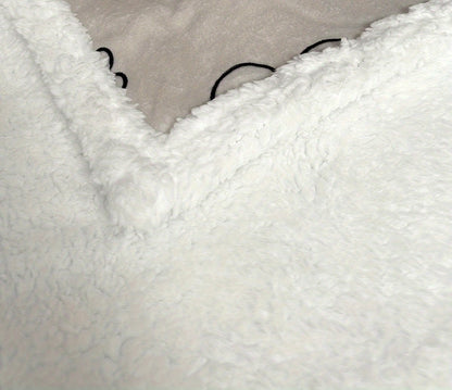 A close-up of the fabric and texture of a pet bed. 