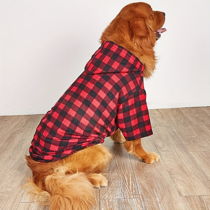 dog from the side as it looks away wearing the red plaid sweatshirt