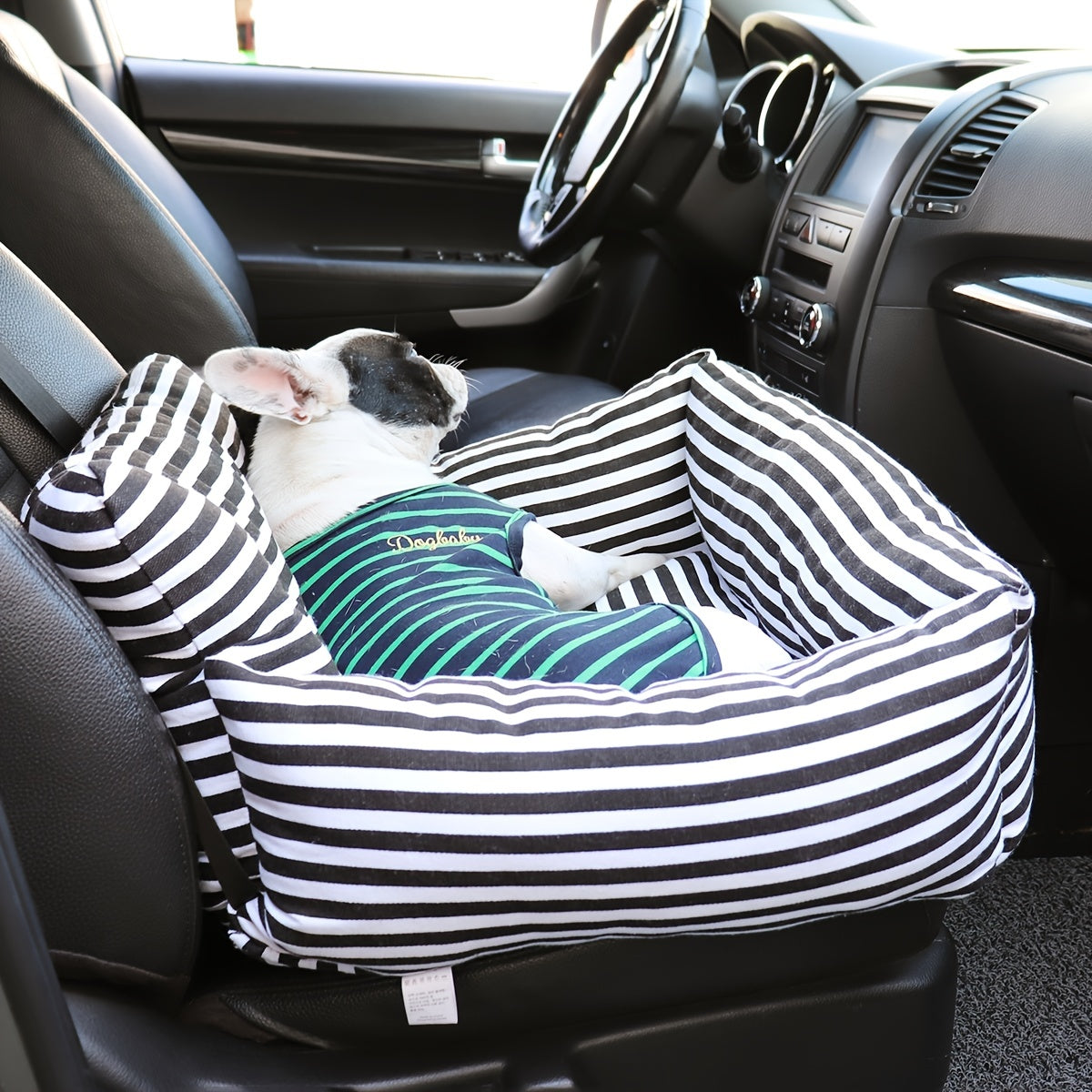 A dog in a plush car seat