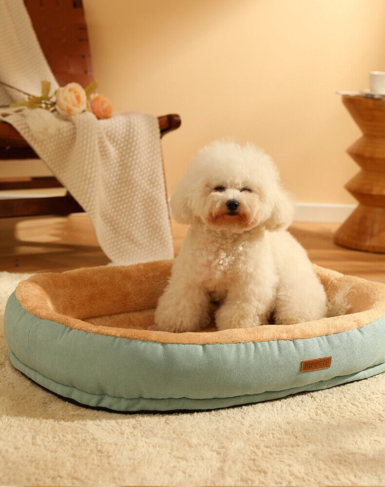 Medium large oval dog bed with orthopedic support and non-slip base for pet comfort.